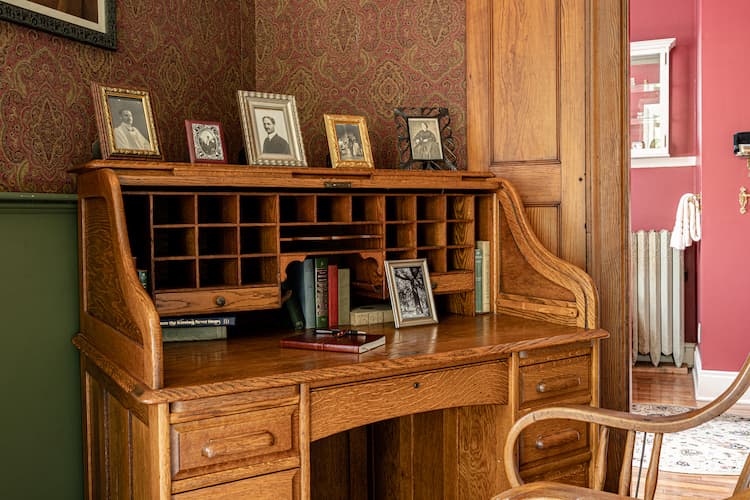 Cozy corner with antique roll top desk with journal for you to write in