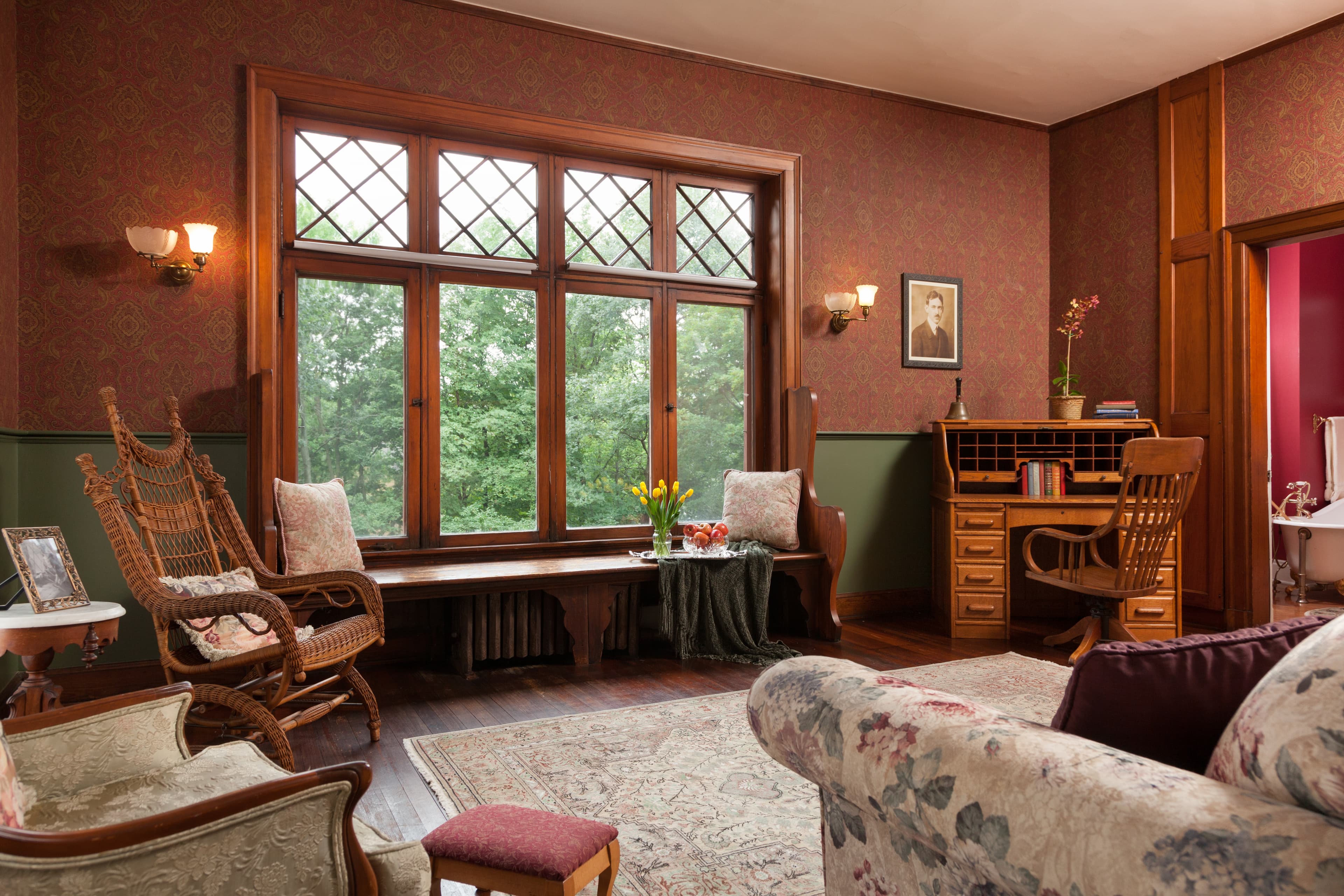 Carl's private sitting room with south facing picture window and window seat. Carl's original wood writing desk to right of window.