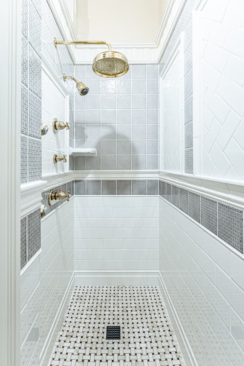 Long walk in subway and wishbone tiled shower with body jets