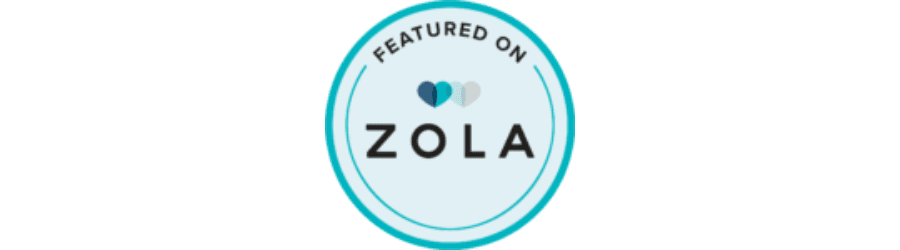 A circular badge displaying "Featured on Zola" with heart icons.