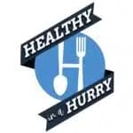 Logo featuring the text "Healthy in a Hurry" with utensils in a blue circle.