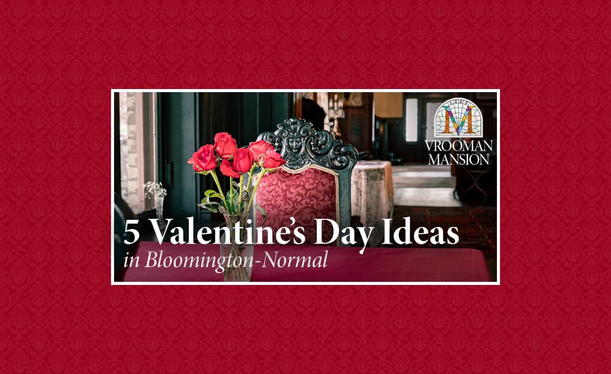 Promotional image for Vrooman Mansion with a bouquet of red roses in a vase on a table, an ornate chair in the background, and the text "5 Valentine's Day Ideas in Bloomington-Normal." Promotional image for Vrooman Mansion with a bouquet of red roses in a vase on a table, an ornate chair in the background, and the text "5 Valentine's Day Ideas in Bloomington-Normal."