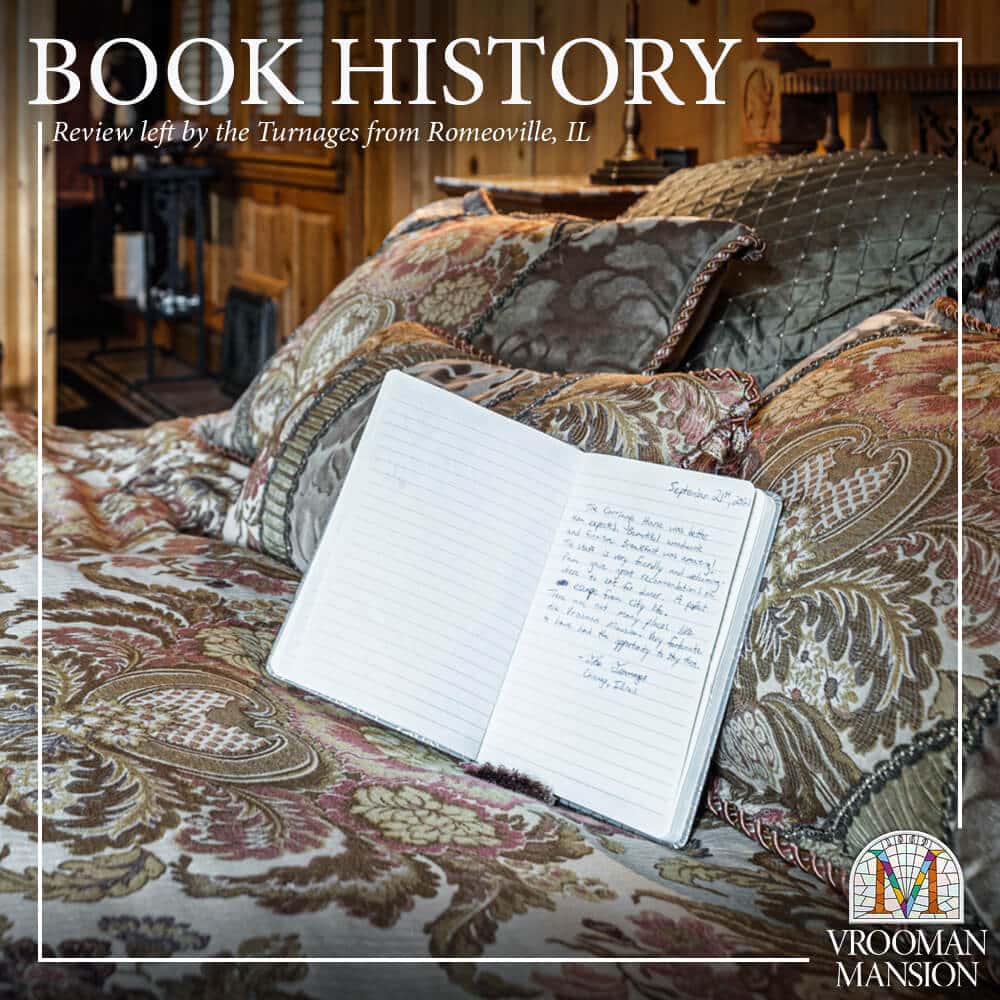handwritten journal with a guest review is open on a vintage bed